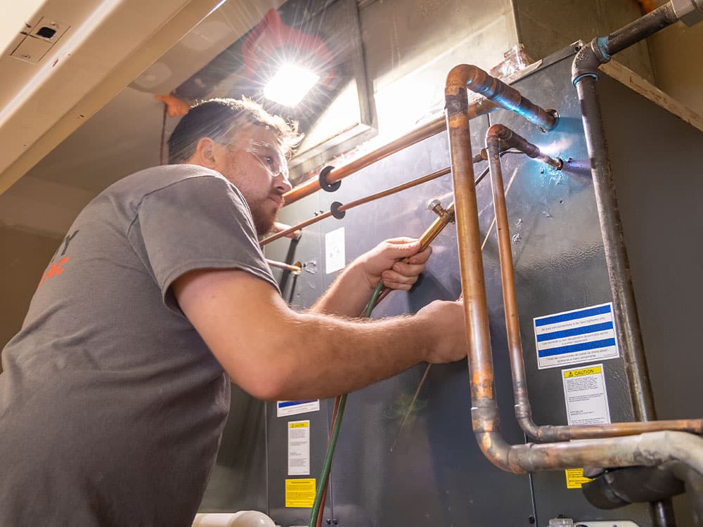 a man standing in front of a machine